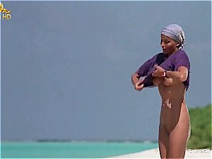 beautiful Bo Derek showcasing off her hairy labia at the beach
