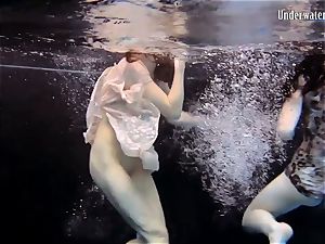 two nymphs swim and get naked super-sexy